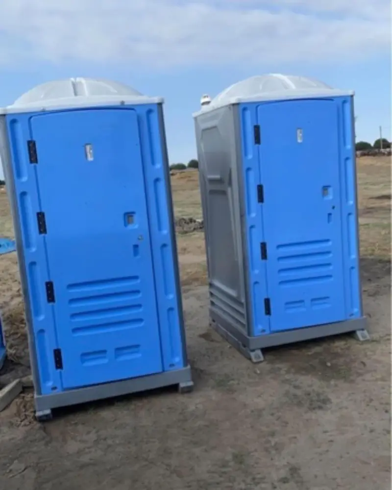 Standard porta potties on a construction site lot