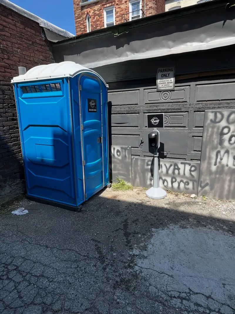 Standard porta potty delivered to a driveway the same day