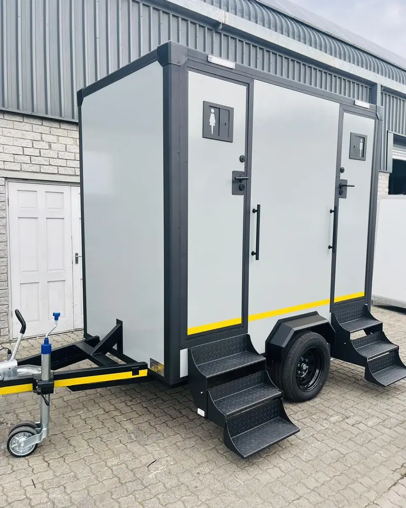 Two-stall restroom trailer with steps